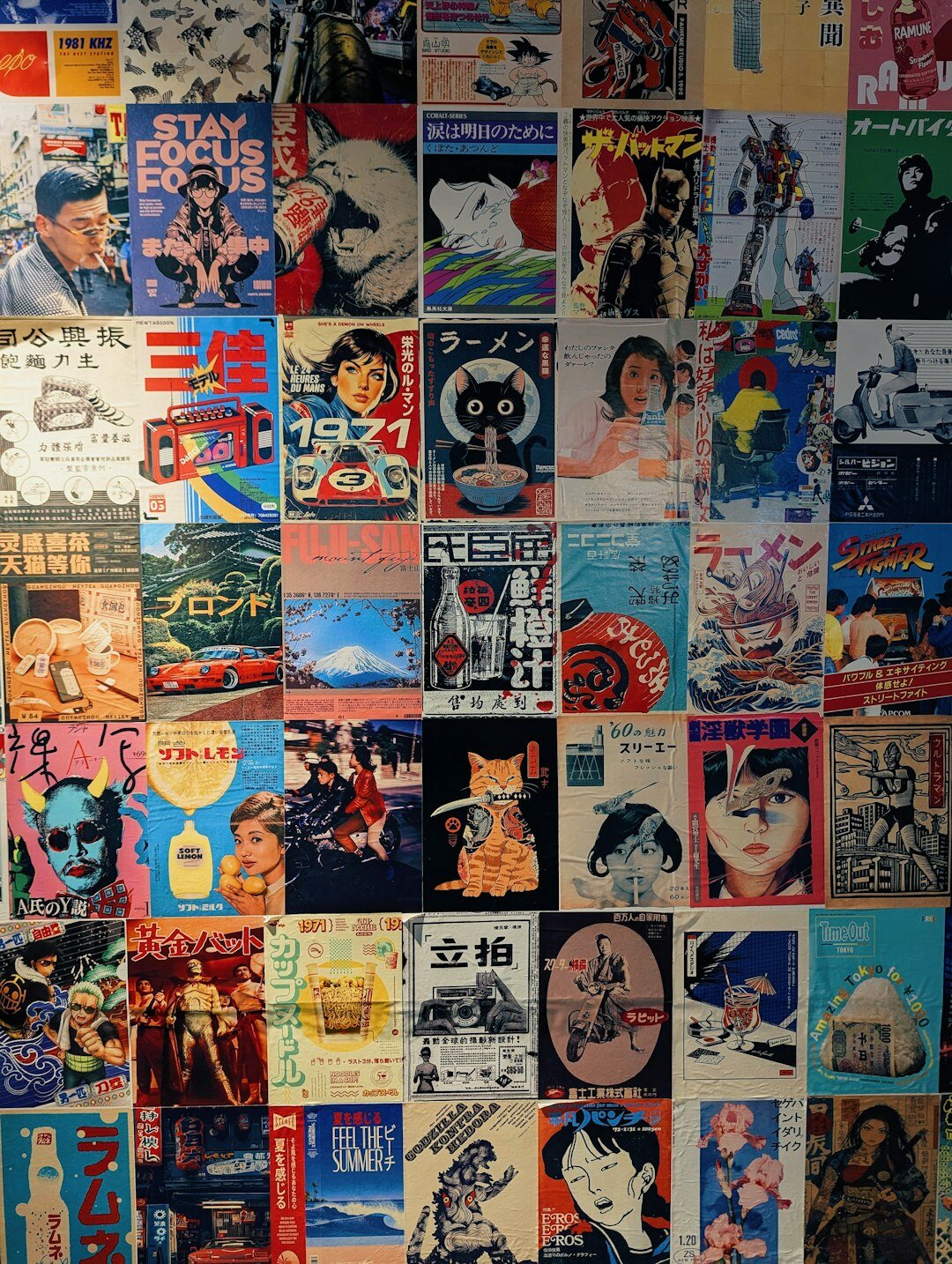 Wall covered with vintage advertising posters from different decades